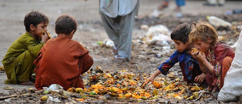 Poor kids eating food from the dump. So sad.