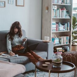 Photo Of Woman Sitting On Couch